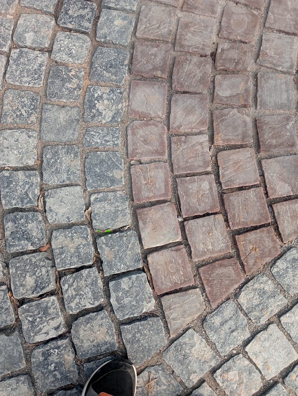 Granite cobblestone paving in a tight laid pattern